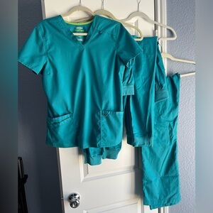 Landau Pro Flex scrubs, one top, three scrubs pants